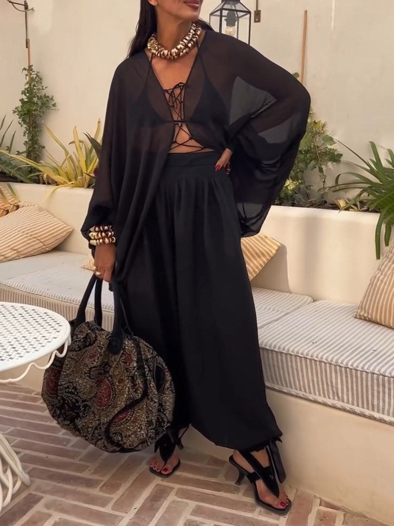 Elegante, transparente, lockere Bluse mit Schnürung