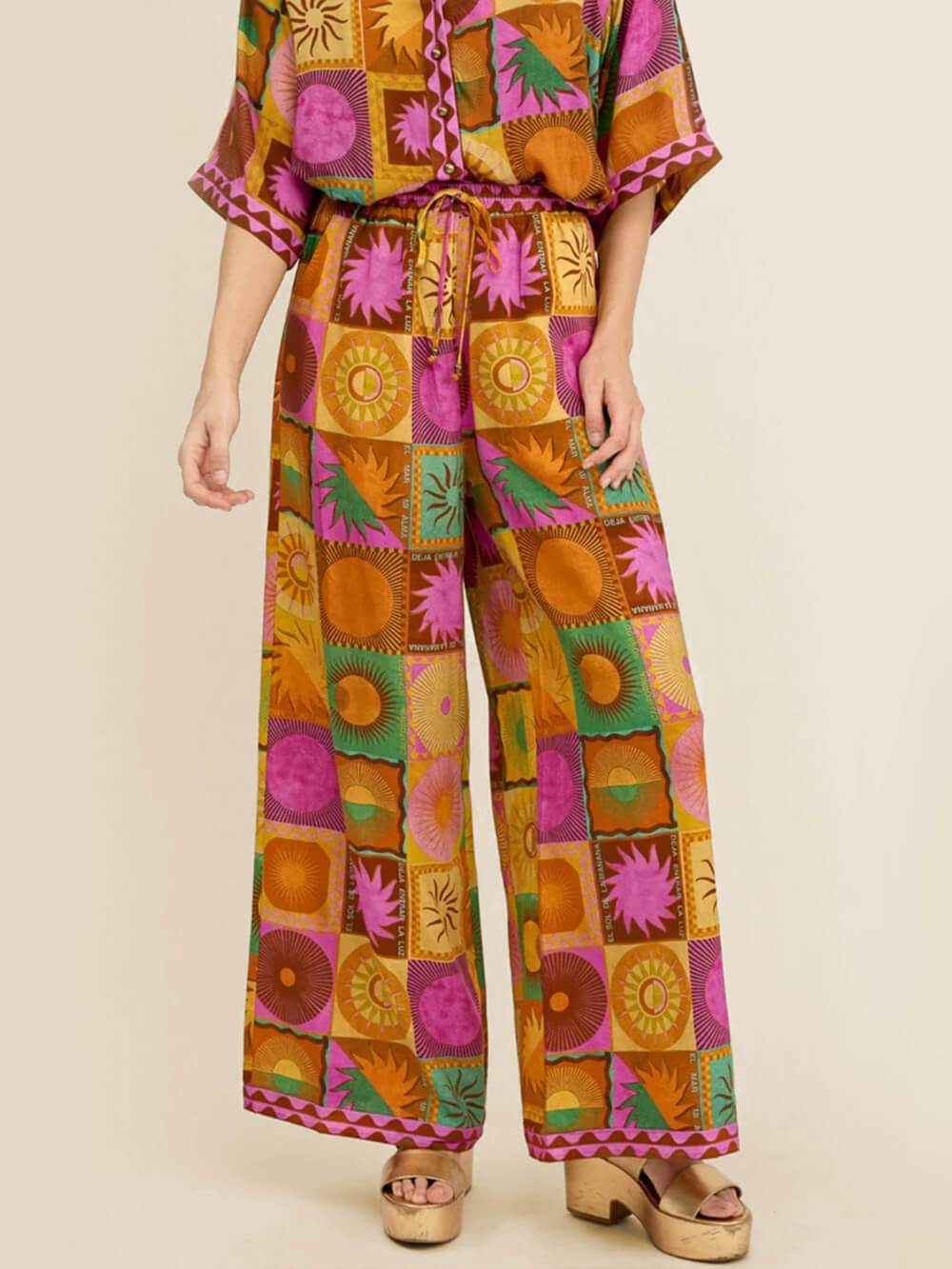 Einzigartige lockere Hose mit weitem Bein und Sonnenmuster
