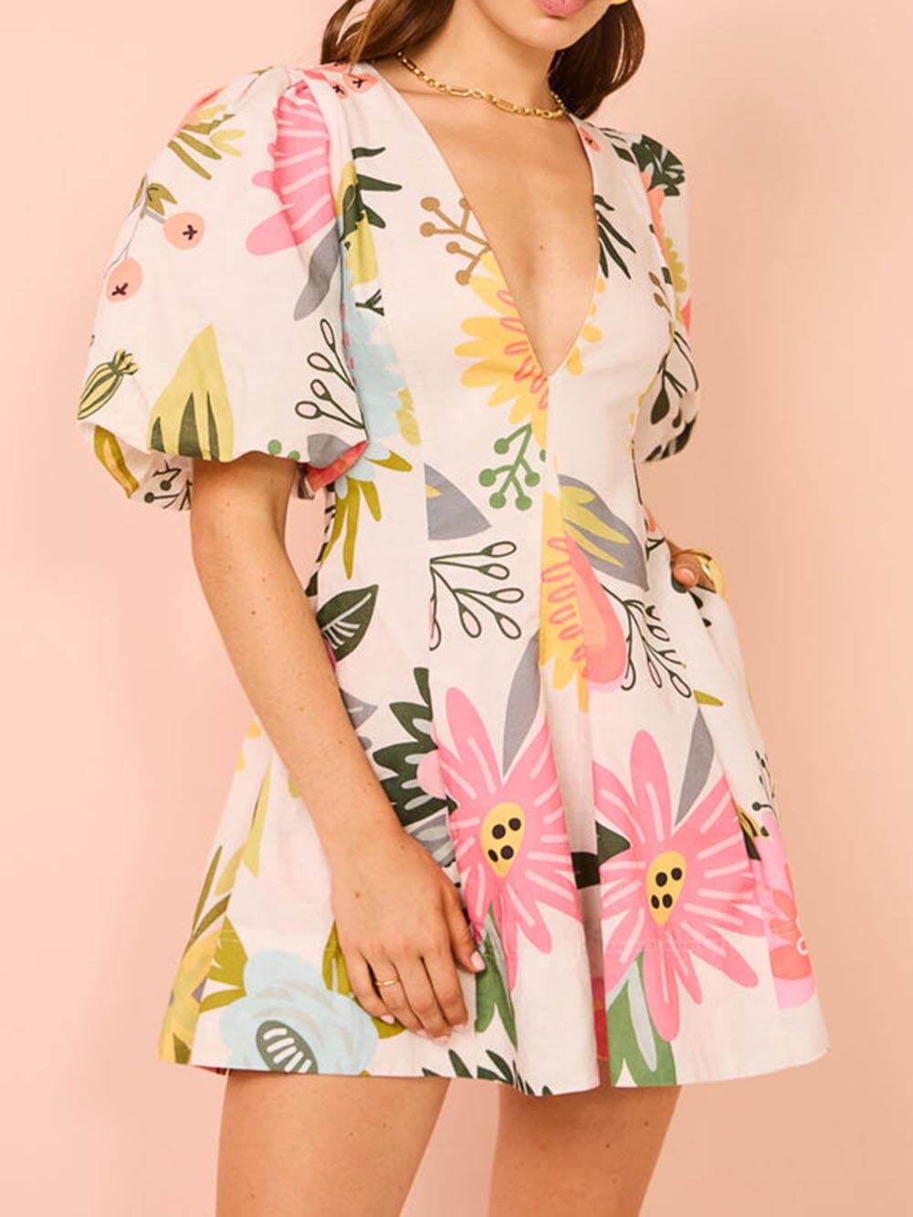 Mini-robe à manches bouffantes et poches à imprimé floral