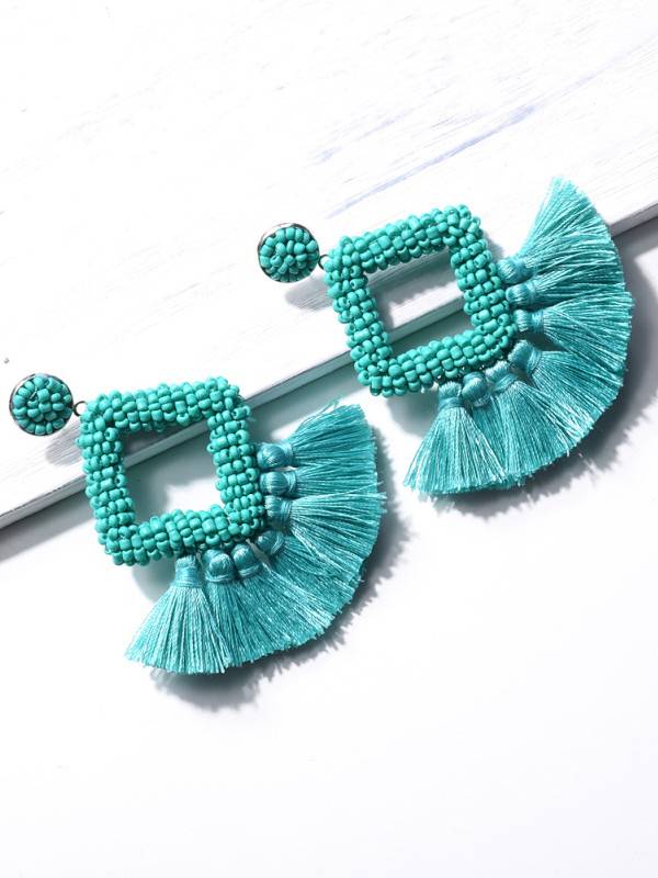 Boucles d'oreilles à pompons tissées à la main
