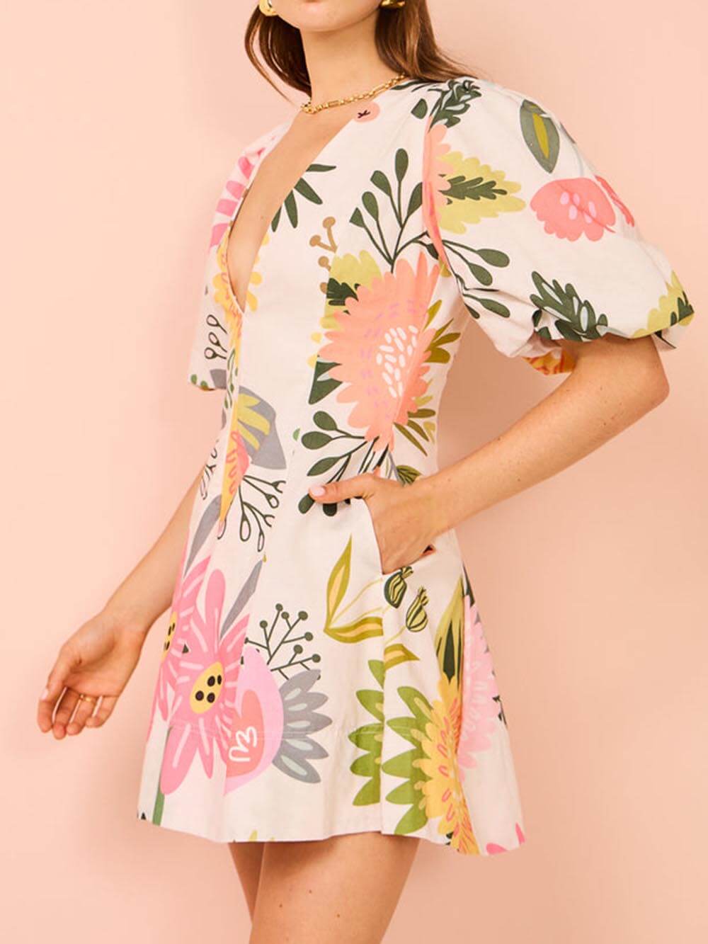 Mini-robe à manches bouffantes et poches à imprimé floral