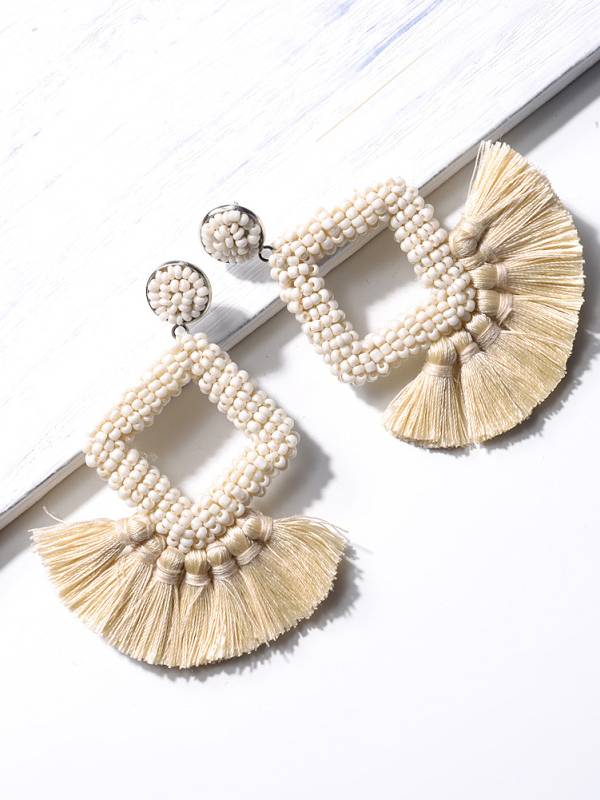 Boucles d'oreilles à pompons tissées à la main