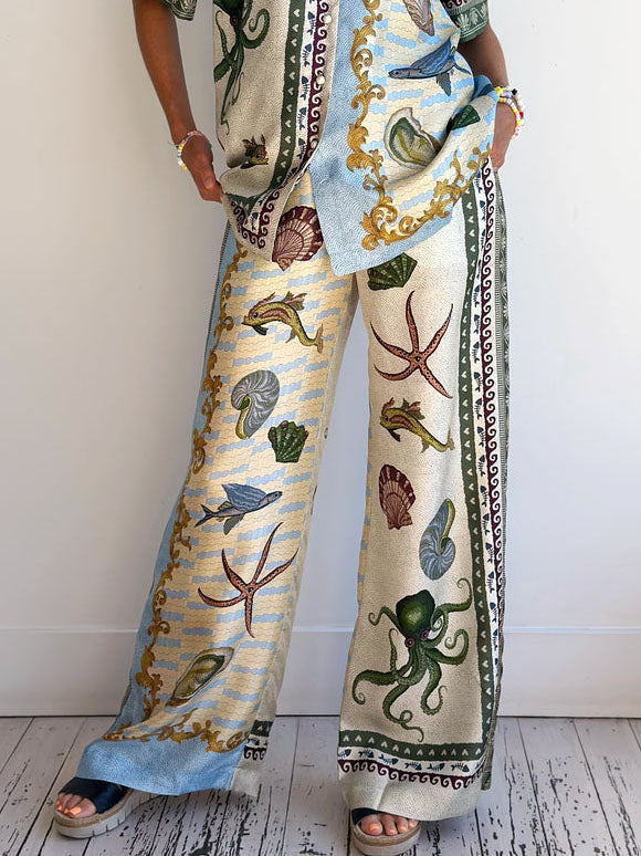 Einzigartige, lockere Hose mit weitem Bein und Blumenmuster im Tiefsee-Stil