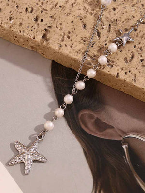Collier asymétrique avec pendentif en perles et étoile de mer