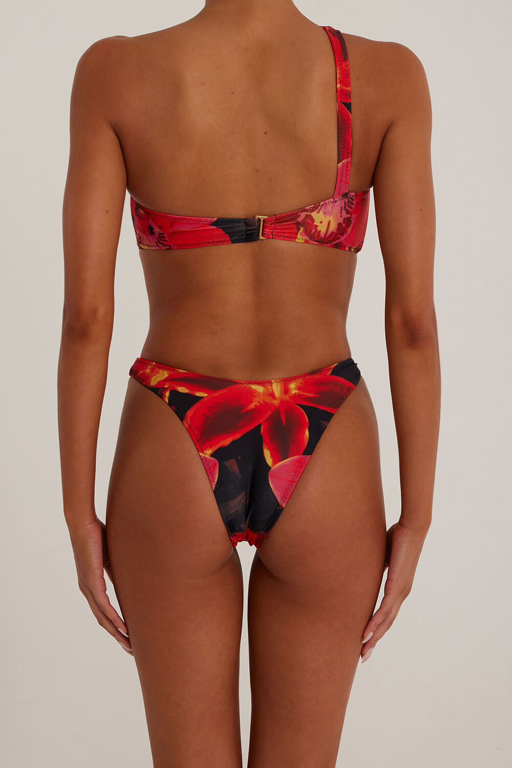 Tropical One Shoulder One Piece Swimsuit With Gold Spiral Hardware Details